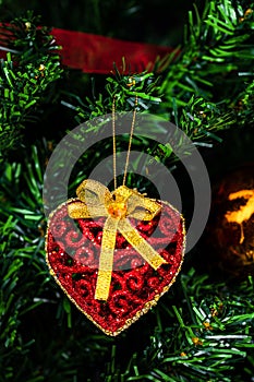 Christmas hanging decorations on fir tree. Decorated Christmas tree. Fir branch with Christmas baubles decorations