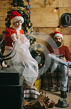 Christmas happy child and father read book.