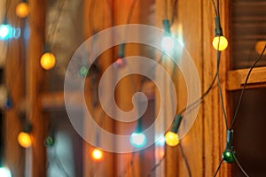 Christmas and Happy new year on blurred bokeh banner background of a luminous garland. Christmas lights background. New Year`s