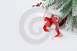 Christmas and happy new year card border with gift box, red berries branch and white toy