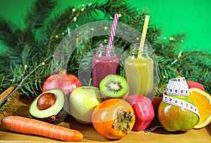 Christmas healthcare concept. Lifestyle fruits and vegetables. Keto diet food ingredient bottles smoothies acai berry measuring