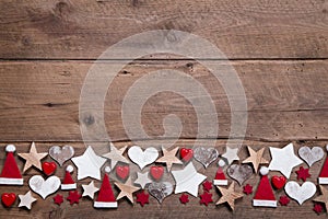 Christmas heart and stars decoration as border or frame on wooden background