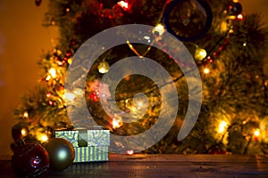 Christmas holiday background with empty wooden deck table over bokeh.