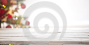 Christmas holiday background with empty wooden table top over festive bokeh light decorate