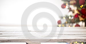 Christmas holiday background with empty wooden table top over festive bokeh light decorate