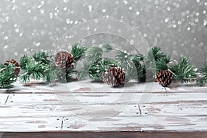 Christmas holiday background with empty wooden white table and Christmas festive lights