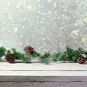 Christmas holiday background with empty wooden white table and christmas lights