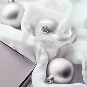 Christmas holiday background, festive baubles and silver vintage gift box as winter season present for luxury brand design