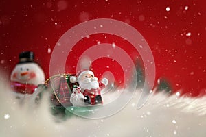 Christmas holiday background with Santa and decorations. Christmas landscape with gifts and snow. Merry christmas and happy new ye