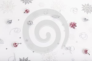 Christmas holiday composition. Festive creative gold silver pattern with ribbon on white background.