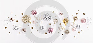 Christmas holiday composition. Festive creative gold silver pattern with ribbon on white background.