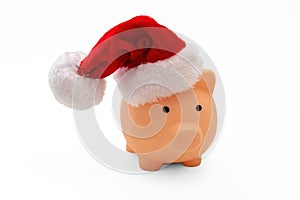 Christmas holiday cost and savings. Piggy bank with Santa hat isolated on white