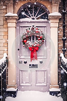 Christmas holiday, country cottage and snowing winter, wreath decoration on a door, Merry Christmas and Happy Holidays wishes,