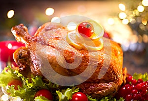 Christmas holiday family dinner. Decorated table with roasted turkey