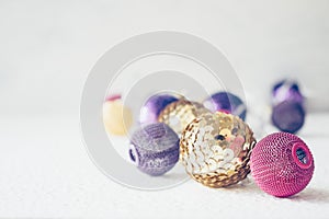 Christmas holiday festive theme with golden pink violet ball LED garland and gold and purple Christmas ornament