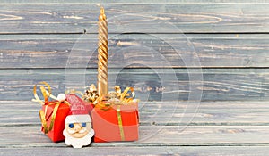 Christmas holiday gifts golden candle an santa`s face