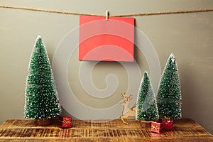 Christmas holiday greeting card mock up with pine tree on wooden table