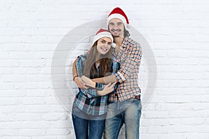 Christmas Holiday Happy Couple Wear New Year Santa Hat Cap, Man And Woman Love Smile Embracing