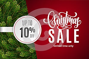 Christmas holiday sale 10 percent off with paper sticker on red background with fir tree branches. Limited time only