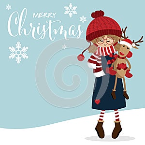 Christmas holiday season background with Cute girl in winter custom with cute reindeer doll and Merry Christmas text.