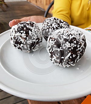 Christmas holiday season snack, dessert, sweets, treat, bakery, confectionery cake: Rum Balls sprinkled with desiccated coconut, c