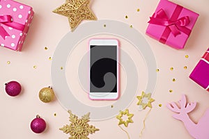 Christmas holiday smart phone mock up, pink gift boxes and decor