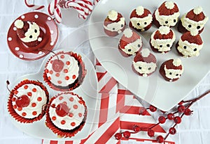 Christmas holiday Strawberry Santas with cherry red velvet cupcakes