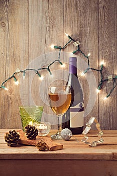 Christmas holiday table setting with wine and Christmas lights