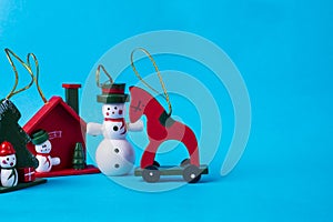 Christmas holiday theme with Christmas wooden toys. On a blue background