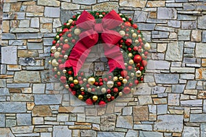 Christmas Holiday Wreath on Stone Wall closeup background