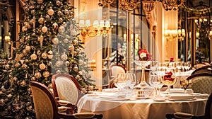 Christmas holidays and New Year celebration, dinner table at a luxury English styled restaurant or hotel interior, Christmas tree