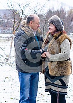 Christmas Holidays, woman and senior man walk at park