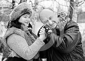 Christmas Holidays, woman and senior man walk at park