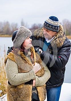 Christmas Holidays, woman and senior man walk at park
