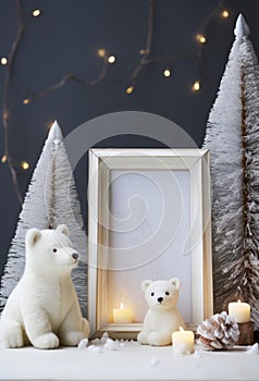 Christmas home decor with candles, figures of bears, empty picture frame and Christmas ornaments on table