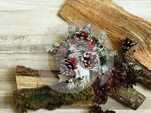 Christmas home decoration and pine cones  on timber wood and bleached oak background.