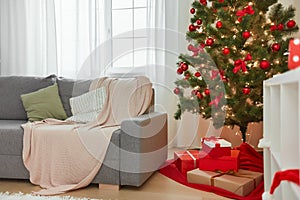 Christmas Home Interior. Stylish Living Room With Christmas Tree, Sofa and Gift Boxes With Presents