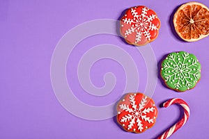 Christmas homemade gingerbread cookies on a bright colored background
