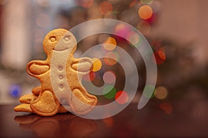Christmas homemade gingerbread cookies on colorful bokeh background