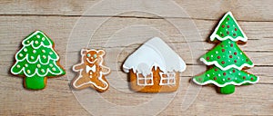 Christmas homemade gingerbread cookies over wooden