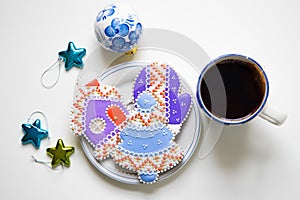 Christmas homemade gingerbread cookies on plate and cup of hot tea