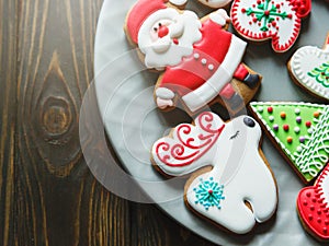 Christmas homemade gingerbread cookies, spices and cutting board on dark background, top view. holiday, celebration and cooking
