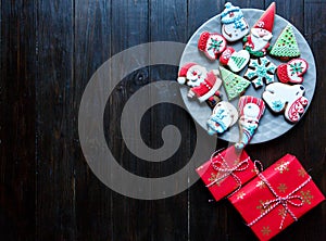 Christmas homemade gingerbread cookies, spices and cutting board on dark background, top view. holiday, celebration and cooking