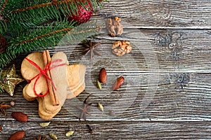 Christmas homemade gingerbread cookies and spices on the wooden background. Christmas mood. Happy New Year and Christmas. Holiday