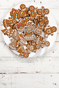 Christmas homemade gingerbread cookies on white wooden table