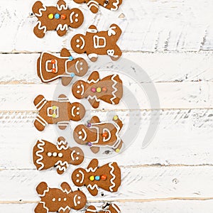 Christmas homemade gingerbread cookies on white wooden table