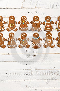 Christmas homemade gingerbread cookies on white wooden table