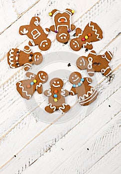 Christmas homemade gingerbread cookies on white wooden table