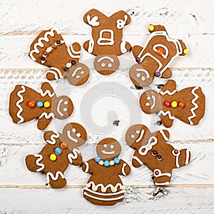 Christmas homemade gingerbread cookies on white wooden table