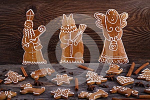 Christmas homemade gingerbread cookies on wooden background